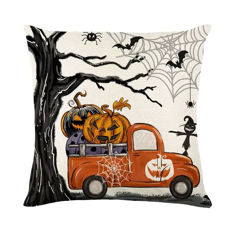 Halloween pumpkin linen cushion cover featuring an orange vintage truck with pumpkins against black tree branches and spiderwebs