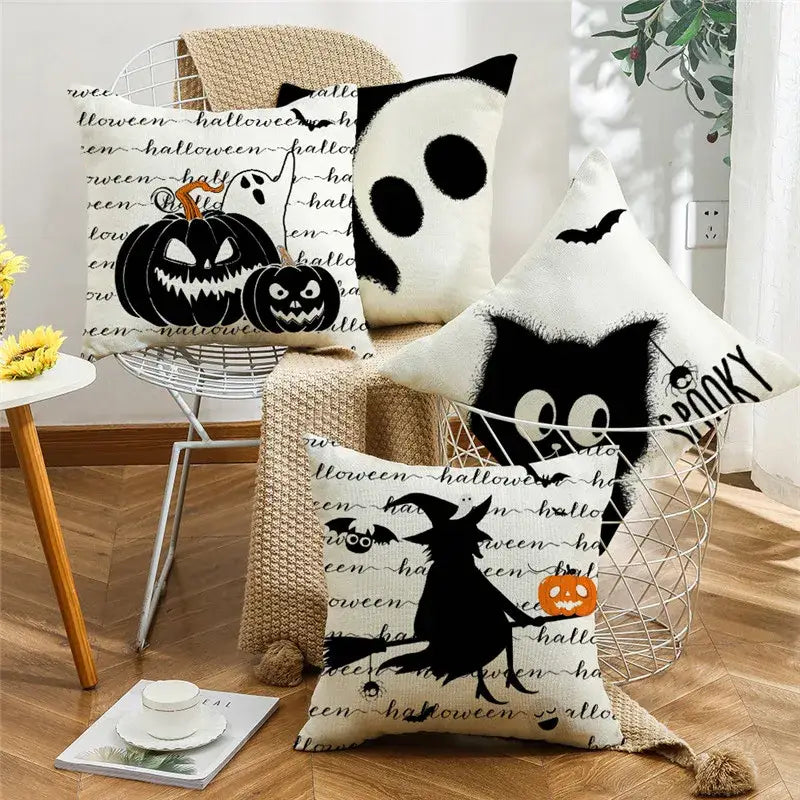 White halloween pumpkin linen throw pillows with black spooky ghost witch and pumpkin designs for living room sofa