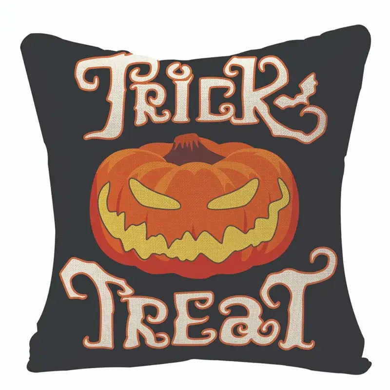 Black halloween pumpkin linen cushion with vibrant orange jack o lantern and trick treat lettering for living room sofa