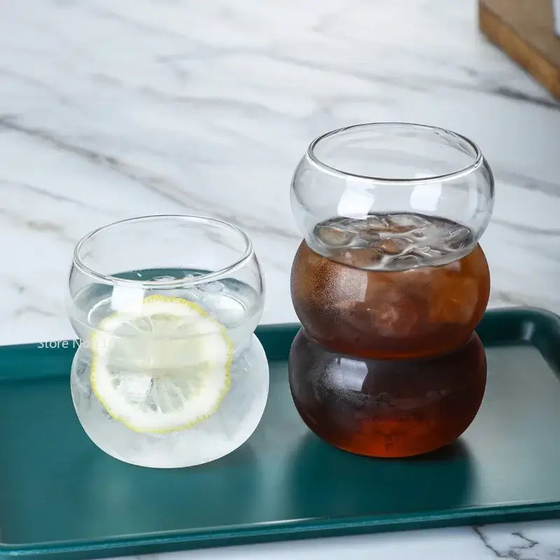 Clear glass cold brew coffee tumblers with stacked rounded design and textured surfaces for brew coffee cup use