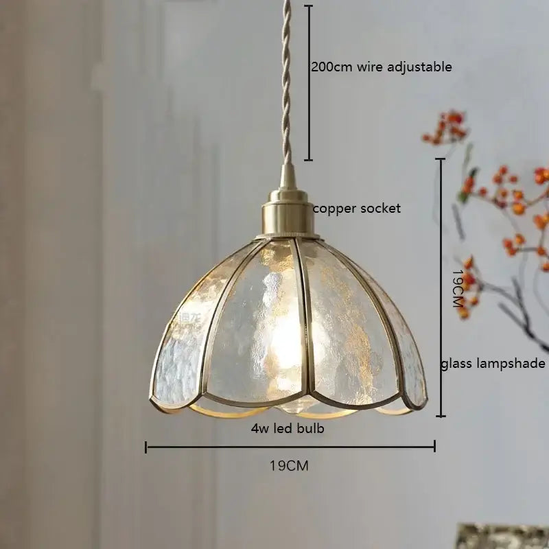 Antique brass-finished pendant light with colorful glass copper shade divided into petal segments for kitchen decorbites