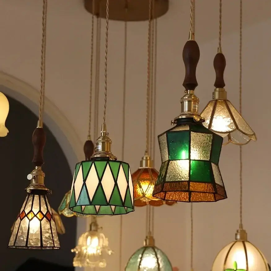 Stained glass floral pendant light featuring green and amber colorful glass copper with brass accents and wooden finials