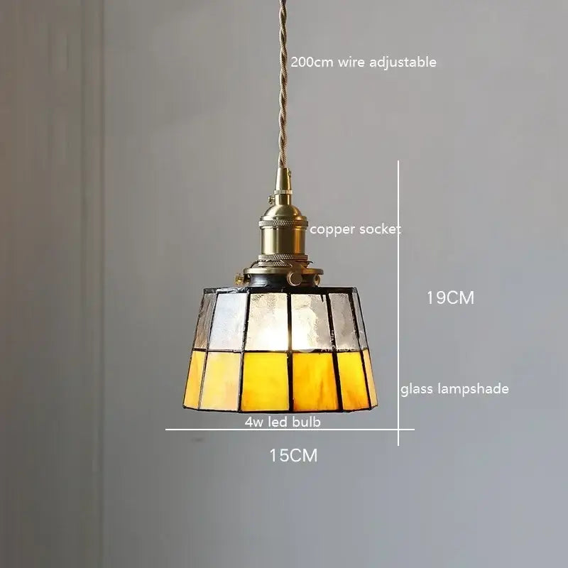 A warm yellow tinted stained glass pendant light with colorful glass copper finish and adjustable 200cm wire socket