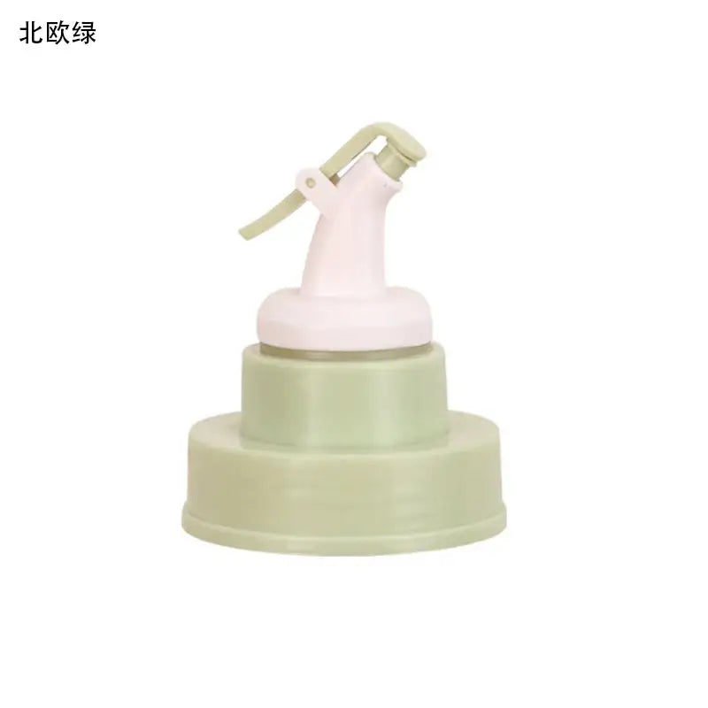 Pastel green and white plastic pump dispenser with two-tiered base for stainless steel bottle cap stopper with colored handle