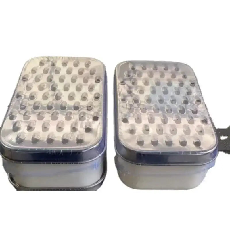 Stainless steel cheese grater with container lid featuring silver rectangular textured surface and transparent covers