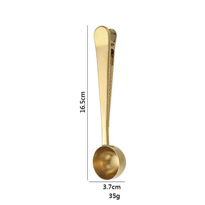 Gold-colored stainless steel coffee spoon with sealing clip measuring 16.5cm long and 3.7cm wide weighing 35g