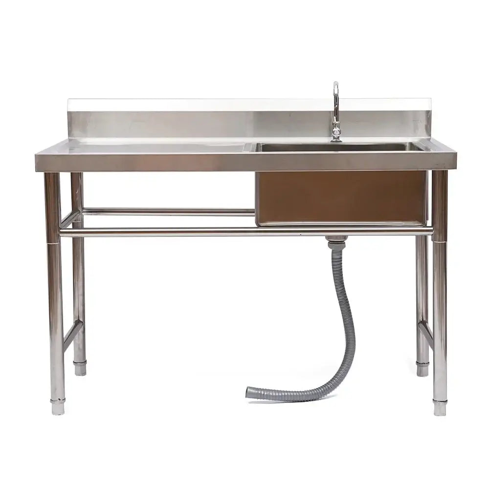 Stainless steel commercial kitchen sink with single basin, left platform, integrated faucet, and sturdy metal legs