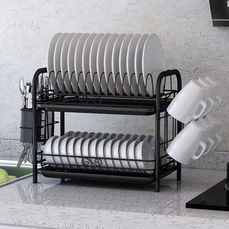 Black metal two-tier stainless steel kitchen drying rack with curved wire shelves holding white plates and mugs organizer shelf