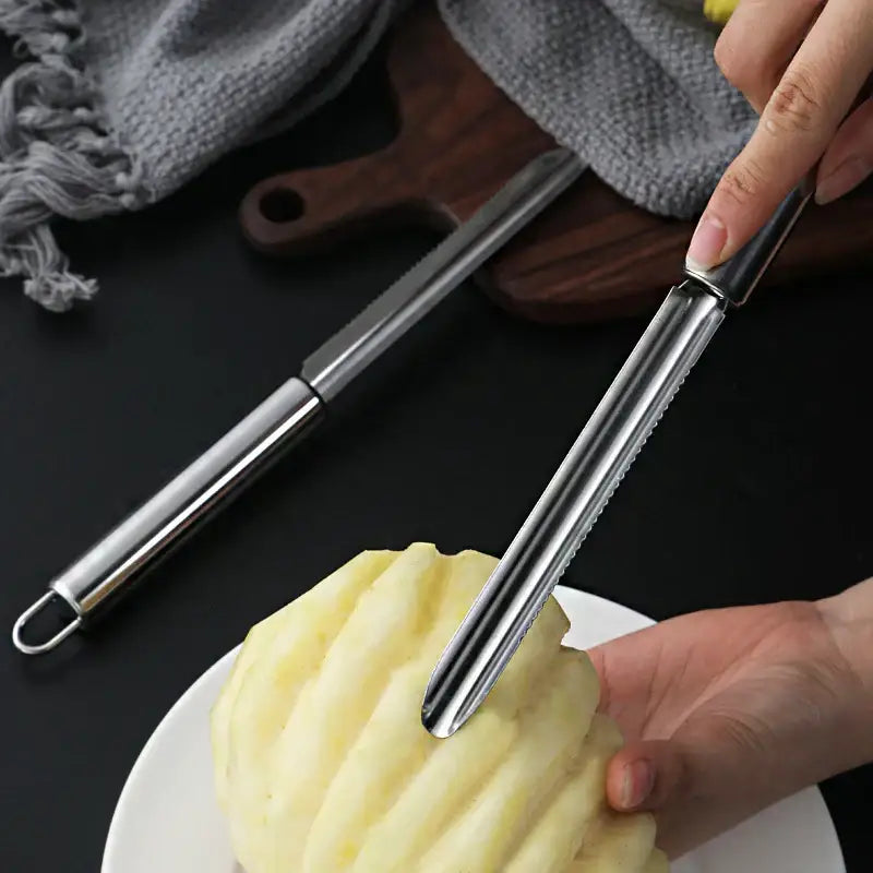 Stainless steel decorbites fruit corer with sleek elongated handle and serrated blade for efficient peeling and slicing