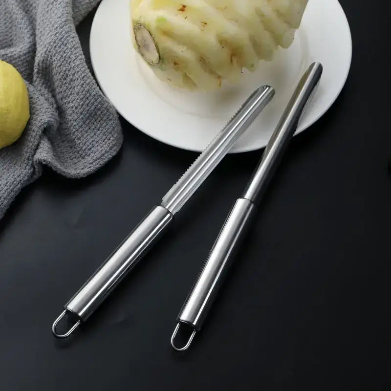 Two sleek stainless steel decorbites fruit corers with polished finish and looped ends for easy use
