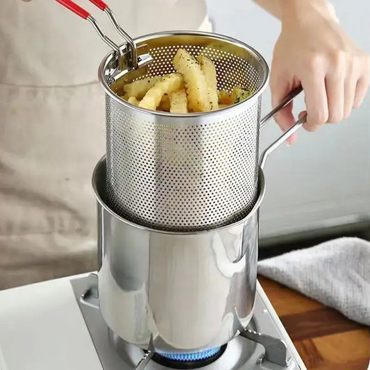Stainless steel deep fryer pot with perforated basket and red-handled tongs for draining fried food by decorbites deep fryer