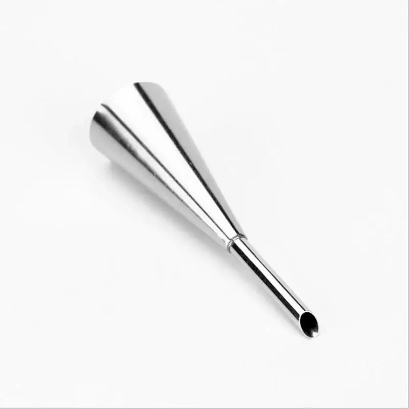 Shiny stainless steel conical piping tip from a puff cream nozzle set for dessert puff cream in kitchen baking