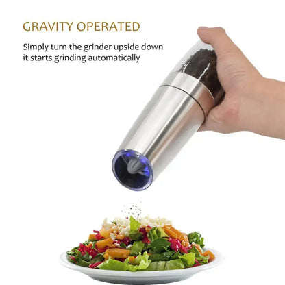 Stainless steel electric spice pepper grinder with blue-tinted base and transparent top for automatic kitchen accessory use