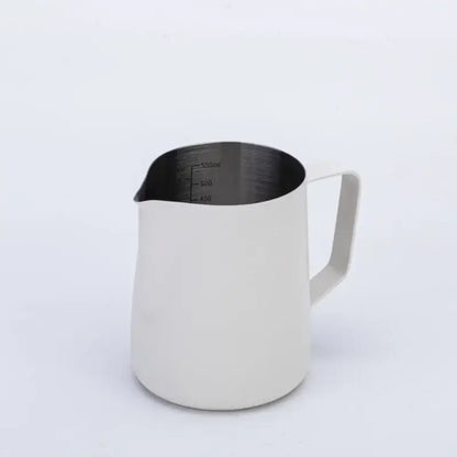A sleek matte white stainless steel milk frothing jug with measurement markings for precise milk frothing