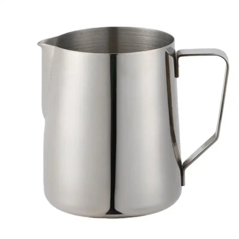 Stainless steel milk frothing jug with measurements featuring a sleek reflective surface and sturdy handle for milk frothing