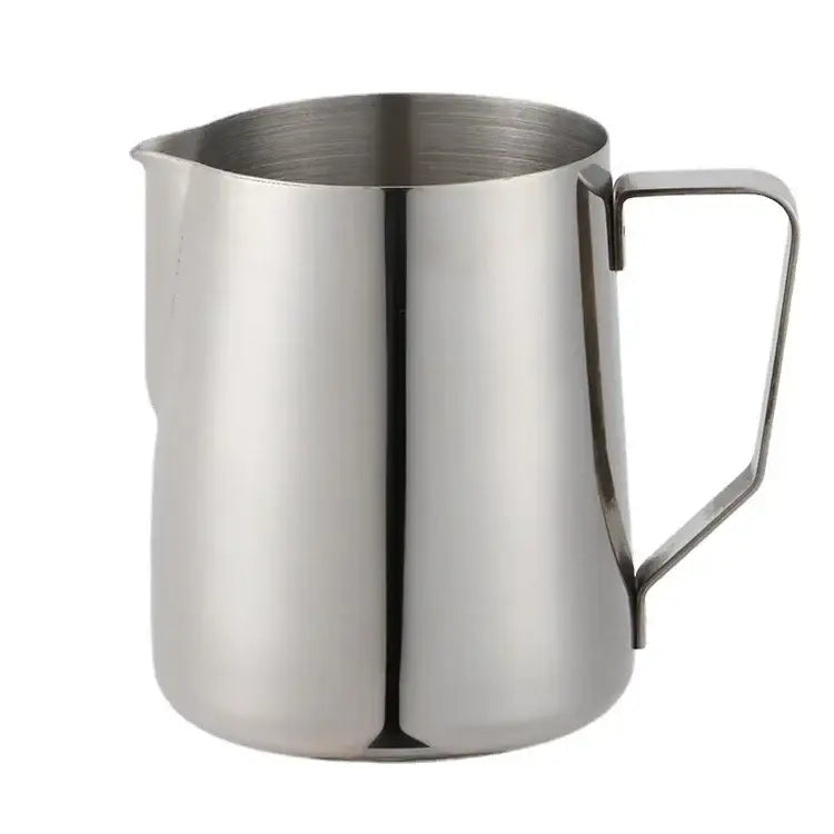 Stainless steel milk frothing jug with measurements featuring a sleek reflective surface and a sturdy handle