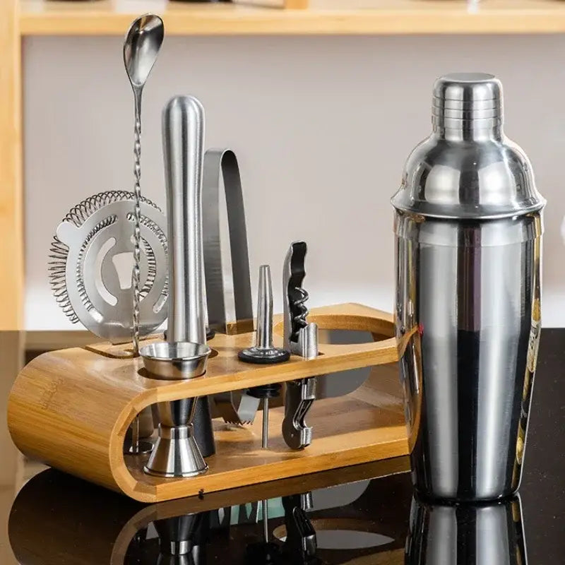 Shiny stainless steel cocktail shaker barman set with bamboo stand holding bar tools from decorbites bartender kit