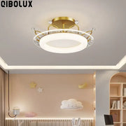 Gold-finished ceiling light with star pattern crystal accents in pink and blue for decorbites kids room ceiling use