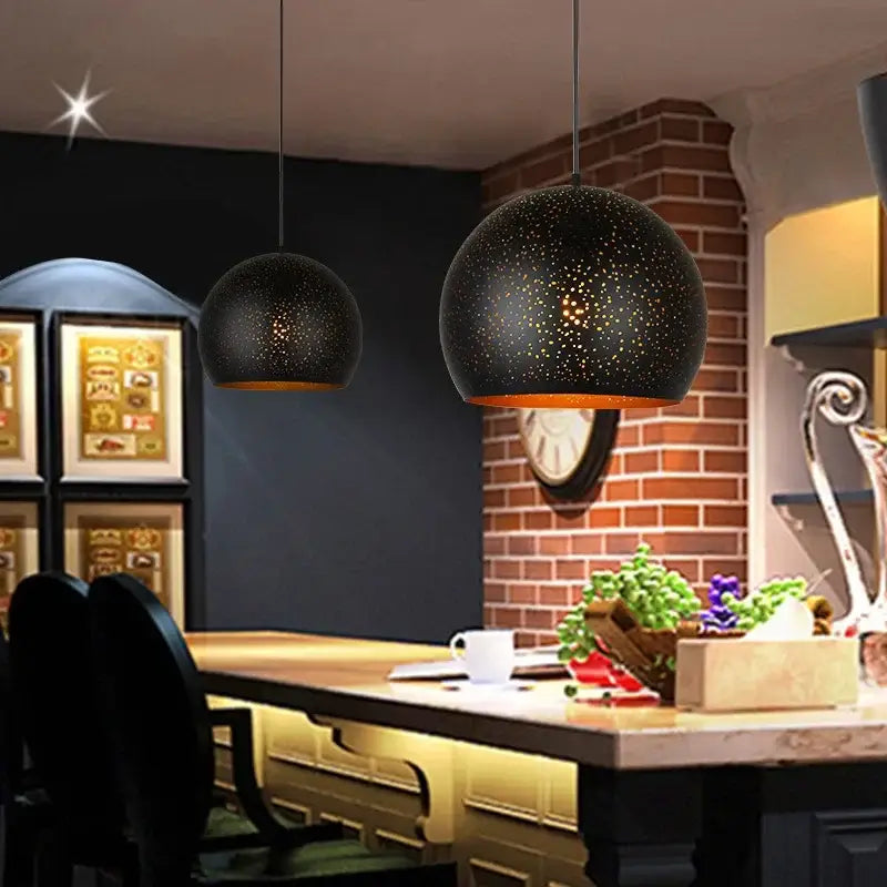Black spherical decorbites black nordic pendant light with starry pattern and warm amber interior for dining room decor