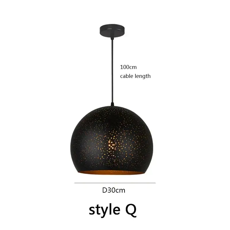 Black spherical pendant light with speckled texture and gold interior by decorbites black nordic for dining room decor