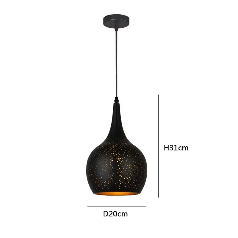 Black pendant light with speckled texture and amber-gold interior by decorbites black nordic for dining room decor