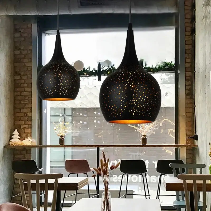 Black nordic pendant light with speckled star pattern and warm amber glow from decorbites black nordic collection
