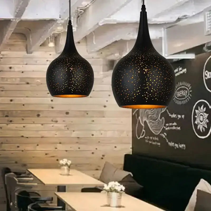 Black pendant light with starry speckled pattern and warm amber interior by decorbites black nordic for dining room decor