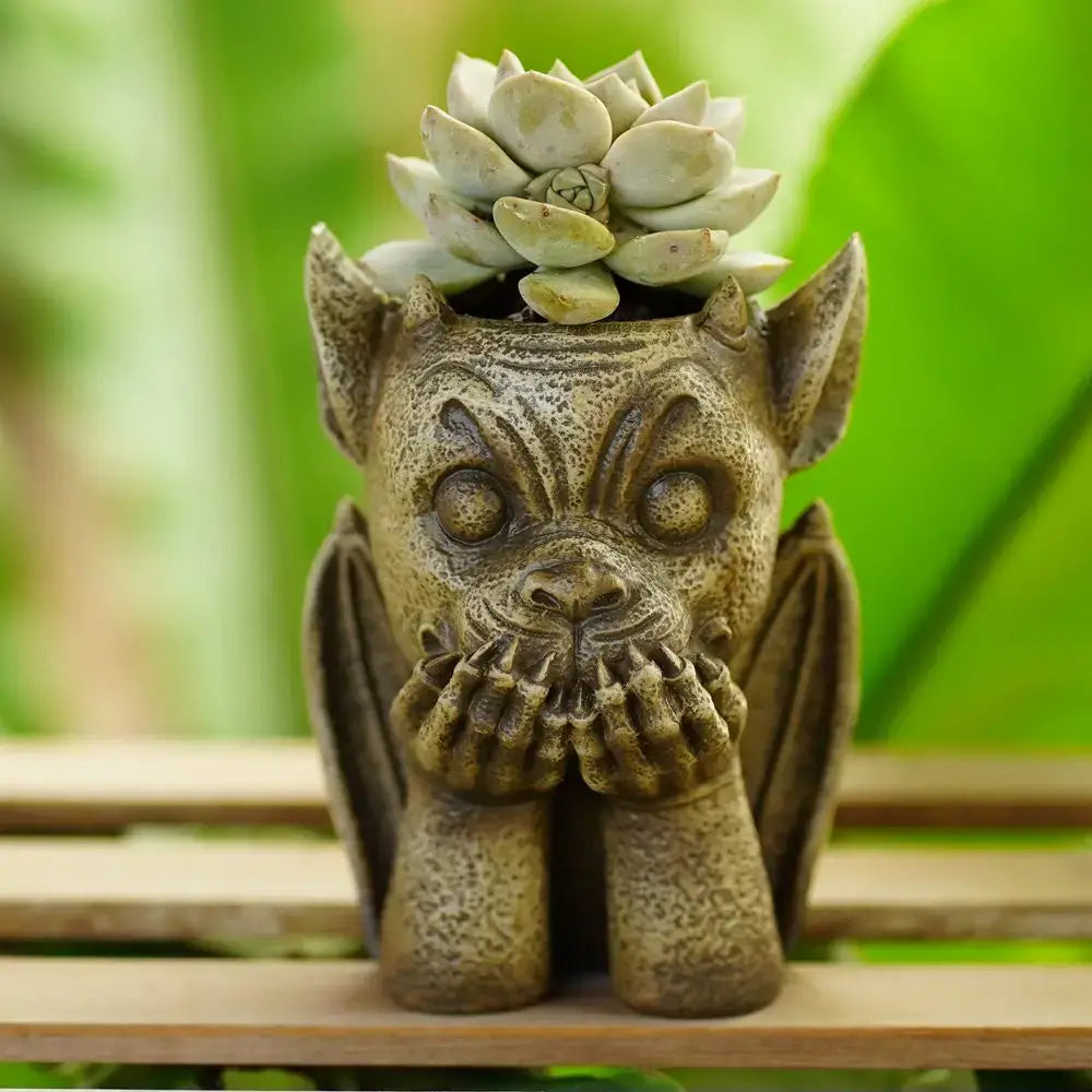 Decorbites gargoyle resin vase sculpture featuring a textured stone-like planter with a pale green succulent