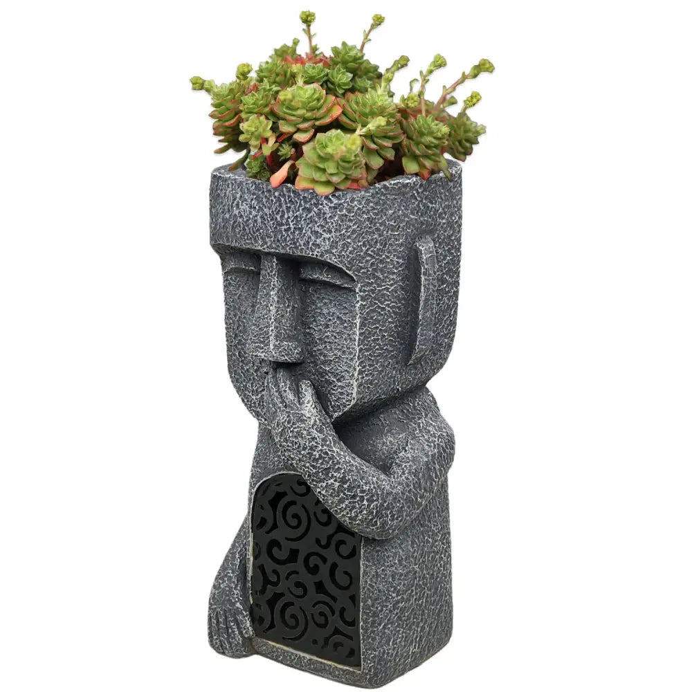 Stone gray easter island statue sculpture planter with textured cracked surface and intricate swirling lower panel patterns