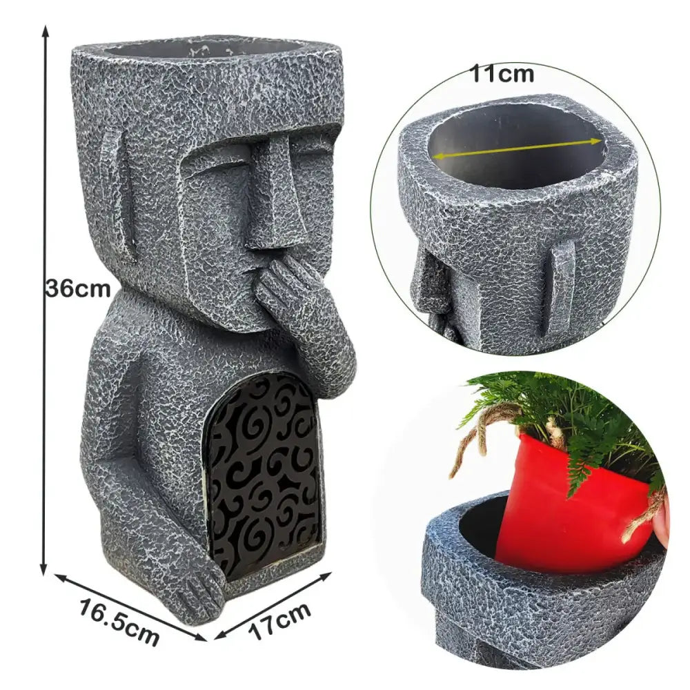 Stone gray easter island statue sculpture garden planter featuring a moai figure with hand-to-mouth gesture and black scrollwork panel