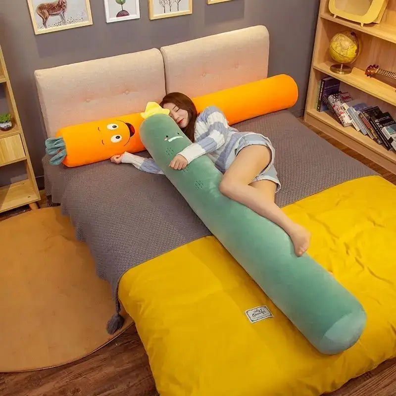 A long green and orange plush decorbites cylindrical soft pregnancy sleep pillow with embroidered face features