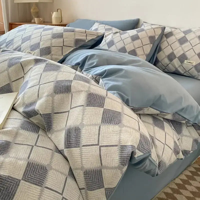 Blue and gray geometric patterned duvet cover set with matching pillowcases and beige cotton fitted sheet bedding set decorbites grid printed