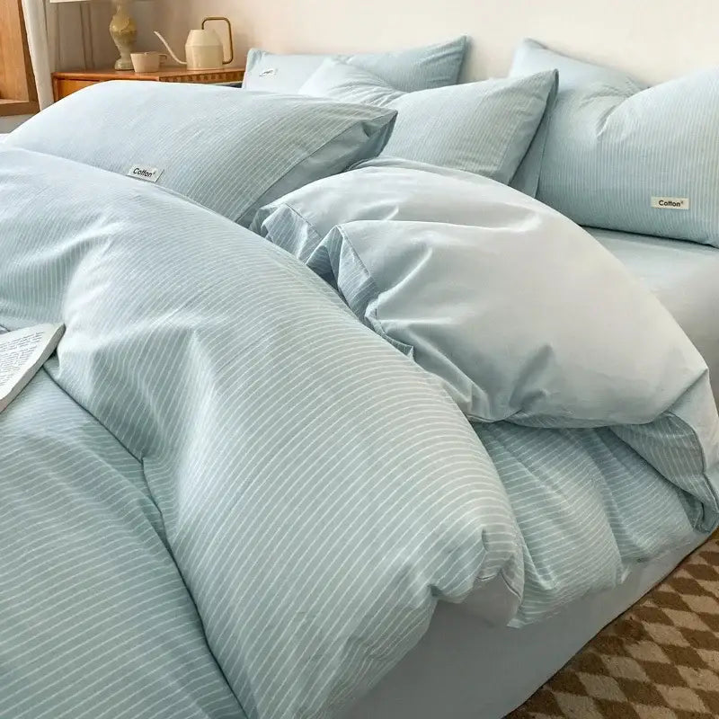 Light blue striped cotton bedding set with fitted sheet and matching pillows from decorbites grid printed collection