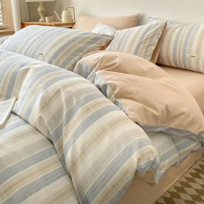 Soft striped beige and blue cotton bedding set with fitted sheet featuring subtle textured weave decorbites grid printed