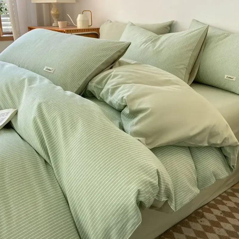 Soft mint green striped cotton bedding set with subtle ribbing and branded tags featuring decorbites fitted sheet