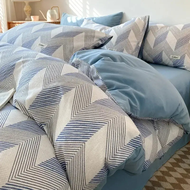 Blue and white geometric patterned bedding set with soft textured fabric and fitted sheet from decorbites grid printed collection