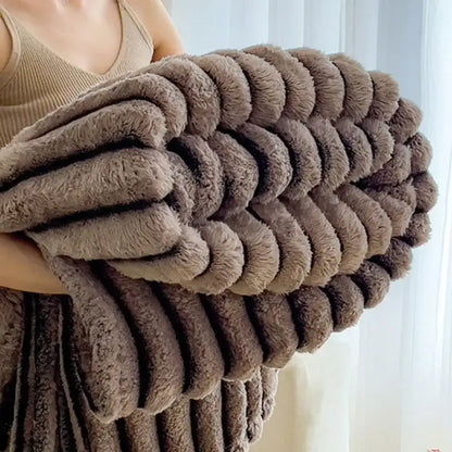 A plush taupe fleece blanket with ribbed texture and soft surface in decorbites dark faux rabbit plush bedroom throw design
