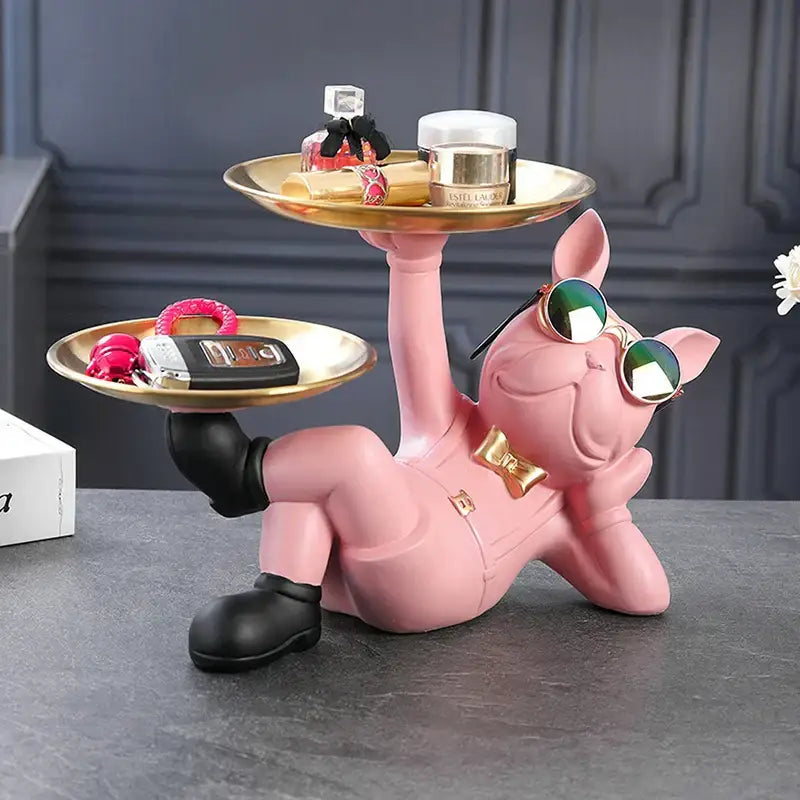 Stylish black and gold bulldog figurine sculpture living room decor featuring a pink pig figurine with sunglasses and trays