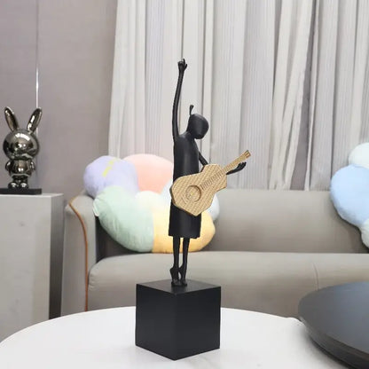 Stylized black and gold guitarist resin figure sculpture with woven guitar on black base for living room decorbites guitarist resin
