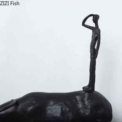 Stylized black matte metal cowherd shepherd boy sculpture with slender humanoid figure for living room decorbites decor