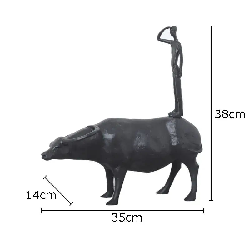 Stylized black matte metal cowherd shepherd boy sculpture depicting a saluting figure atop a buffalo for living room decorbites decor