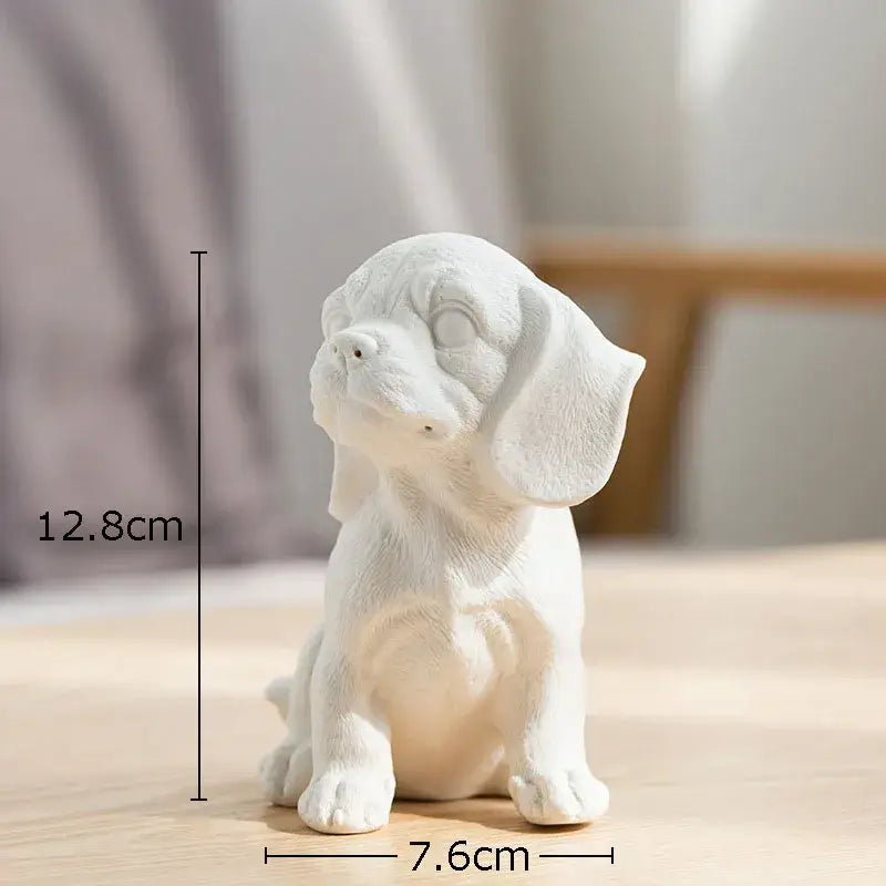 Stylized white matte ceramic sculpture of a sitting beagle puppy miniature figurine for living room decor