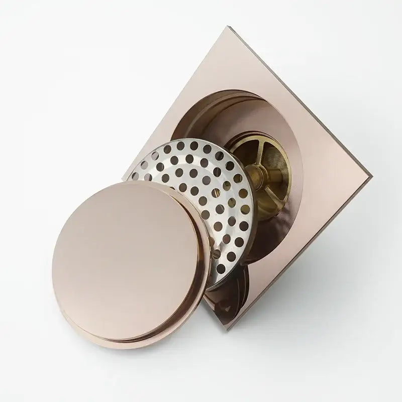 Rose gold brass square shower floor drain with matching circular cover and perforated strainer by decorbites brass square