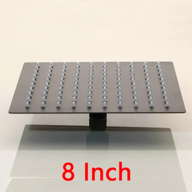 Super slim matte black square shower head with grid of small nozzles for a modern rain shower experience