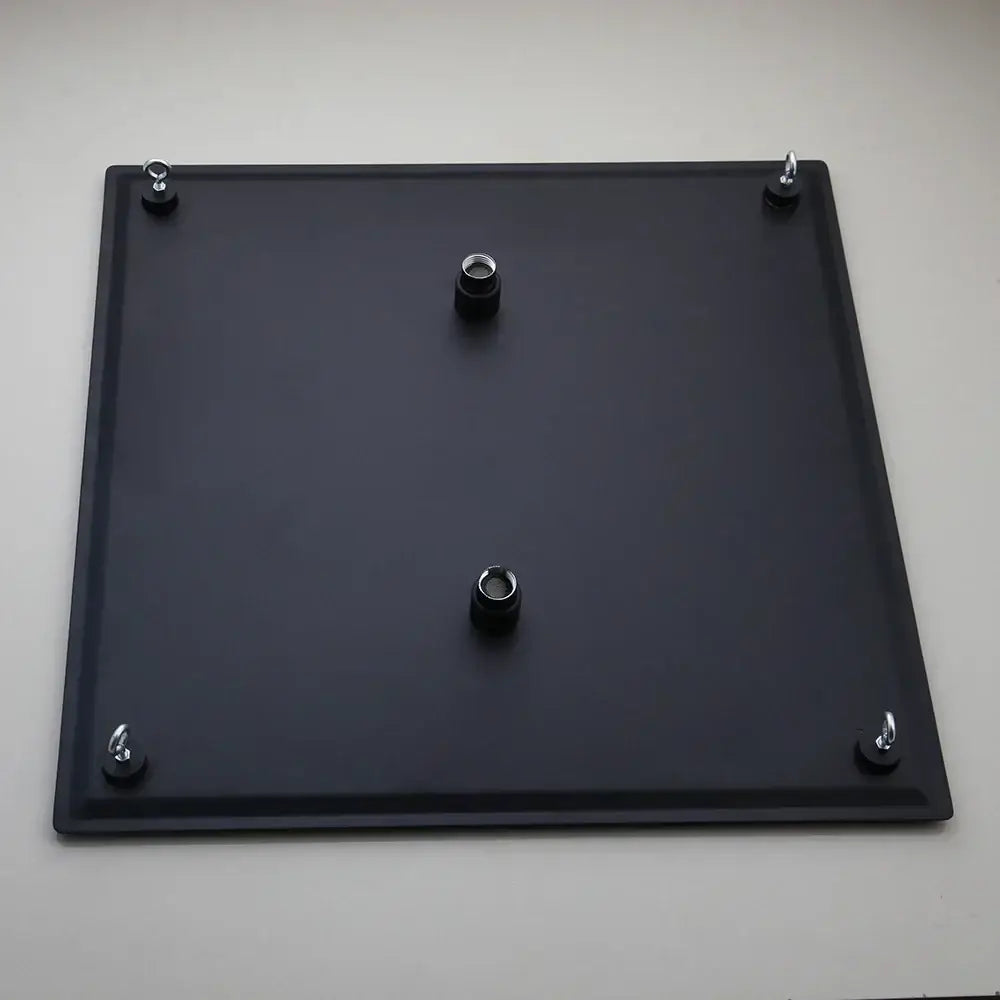 Backside of a super slim matte black square shower head mounting plate with four hooks and three threaded inserts