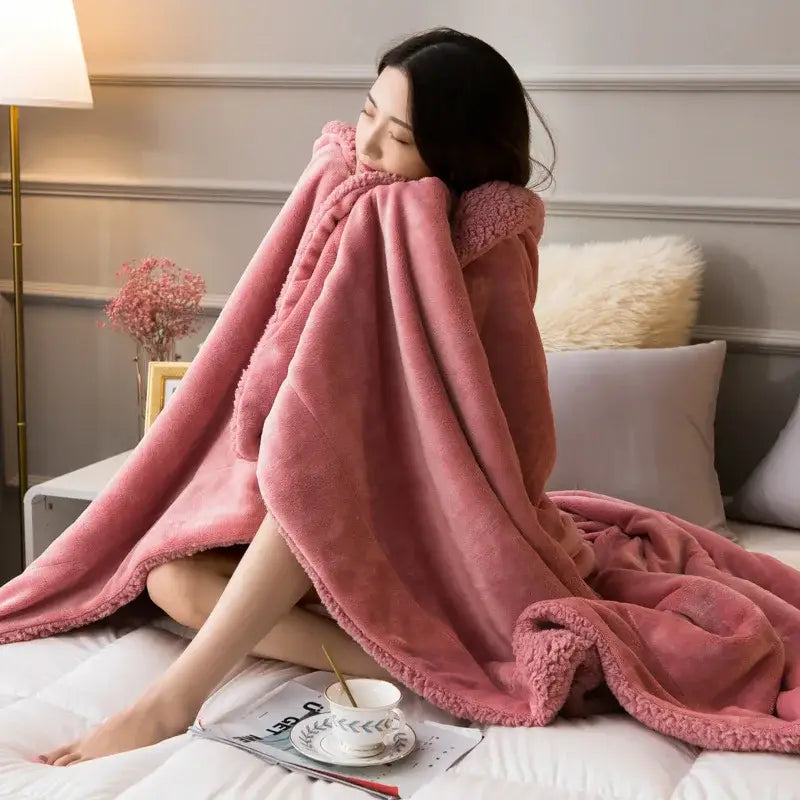 A plush pink fleece lambswool flannel blanket with a soft textured surface and cozy hooded edges for decorbites cozy lambswool