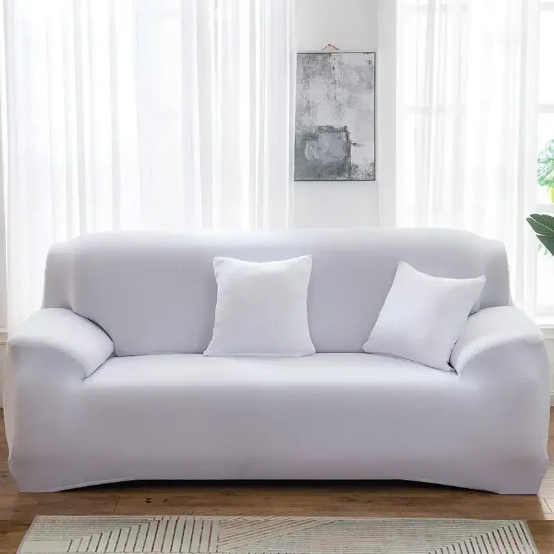 White stretchy silk sofa cover snugly fits three-seater couch with matching pillows for living room and accent chairs
