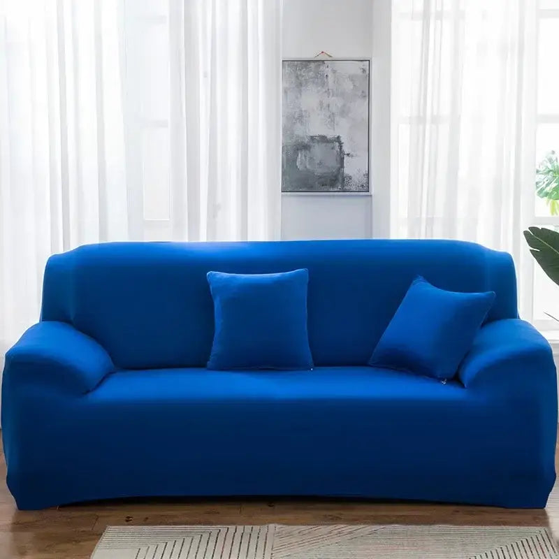 Vibrant royal blue stretchy silk sofa cover with matching pillows for living room and accent chairs