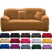 Tan stretchy silk sofa cover with matching pillows in living room setting for sofas and accent chairs