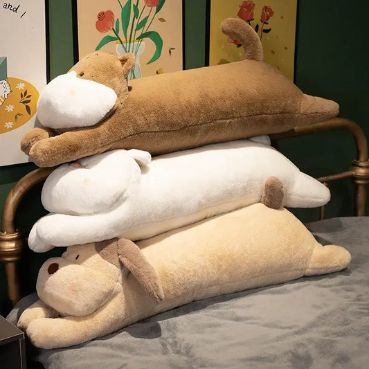 Three plush tan white and beige dog sleeper body pillows with soft fur-like material for bedroom leg support